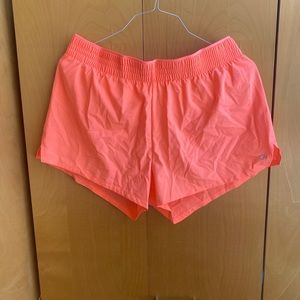Bright coral exercise shorts!